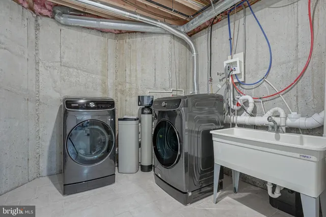 a utility room with dryer and washer