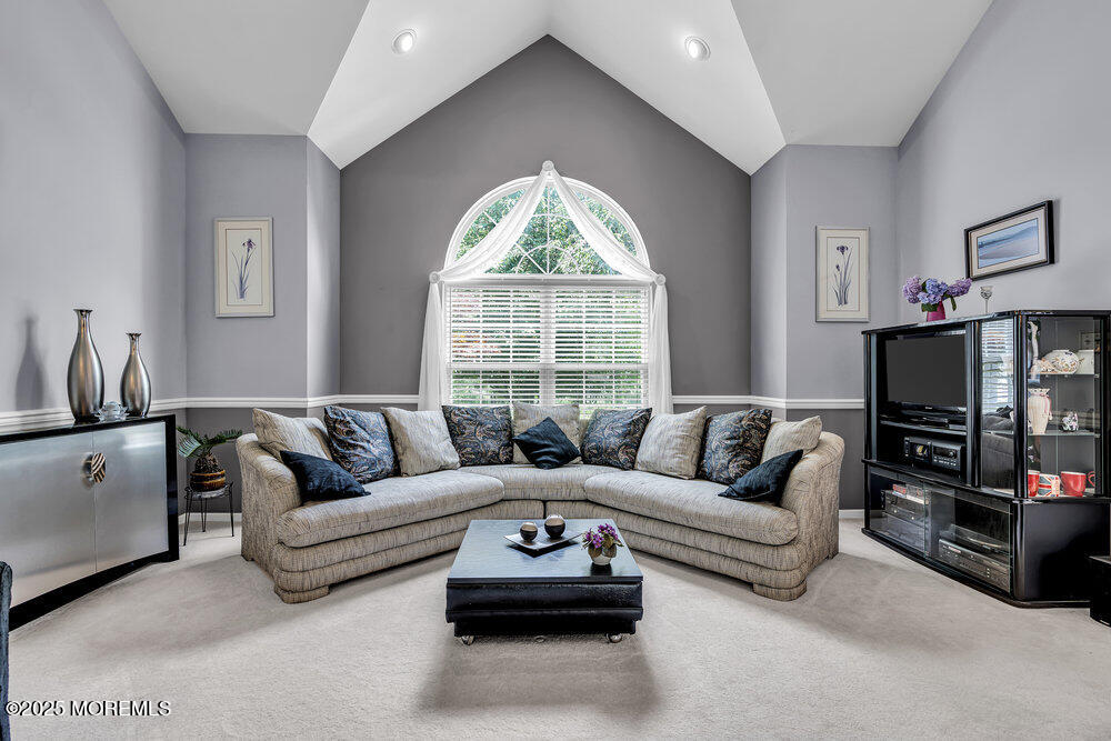 32 Tilton Road Brick, NJ 08723 - Photo 22 of 100 a living room with furniture a flat screen tv and a large window