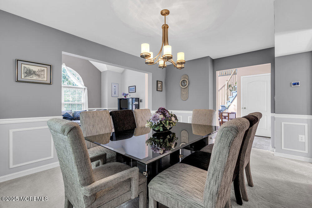 32 Tilton Road Brick, NJ 08723 - Photo 26 of 100 a view of a dining room with furniture a chandelier and wooden floor