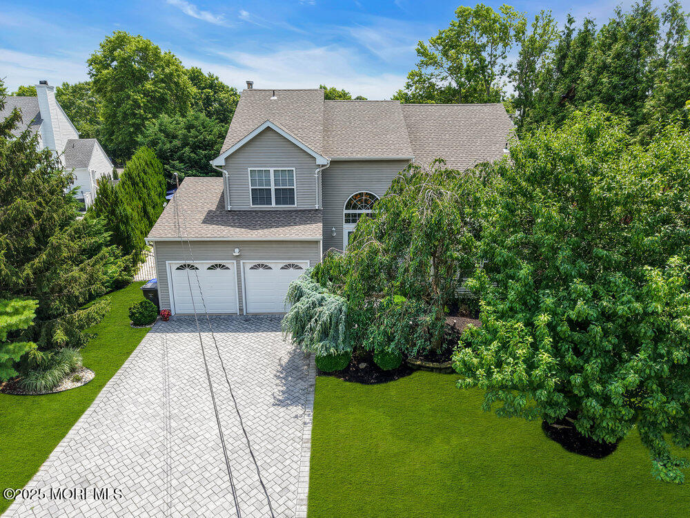 32 Tilton Road Brick, NJ 08723 - Photo 3 of 100 a house with green field in front of it