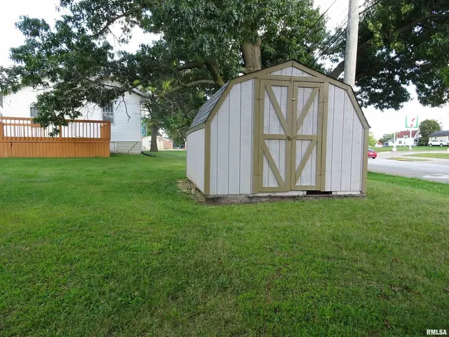 a view of backyard with tub and trees