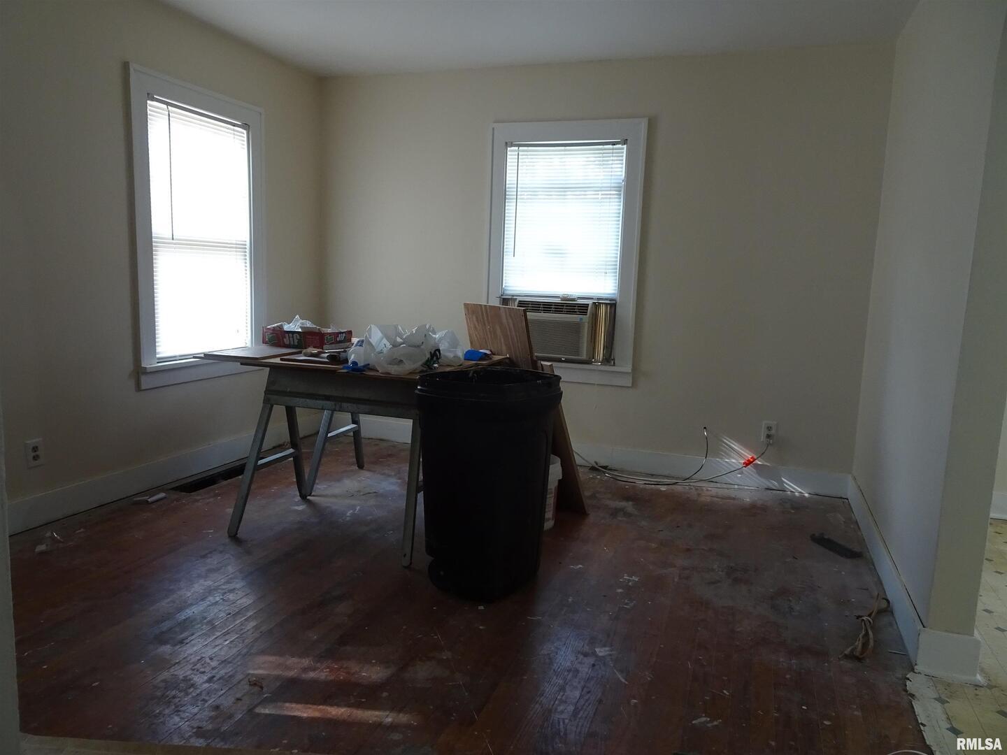 917 3rd Street Silvis, IL 61282 - Photo 18 of 22 a workspace with wooden floor and a window