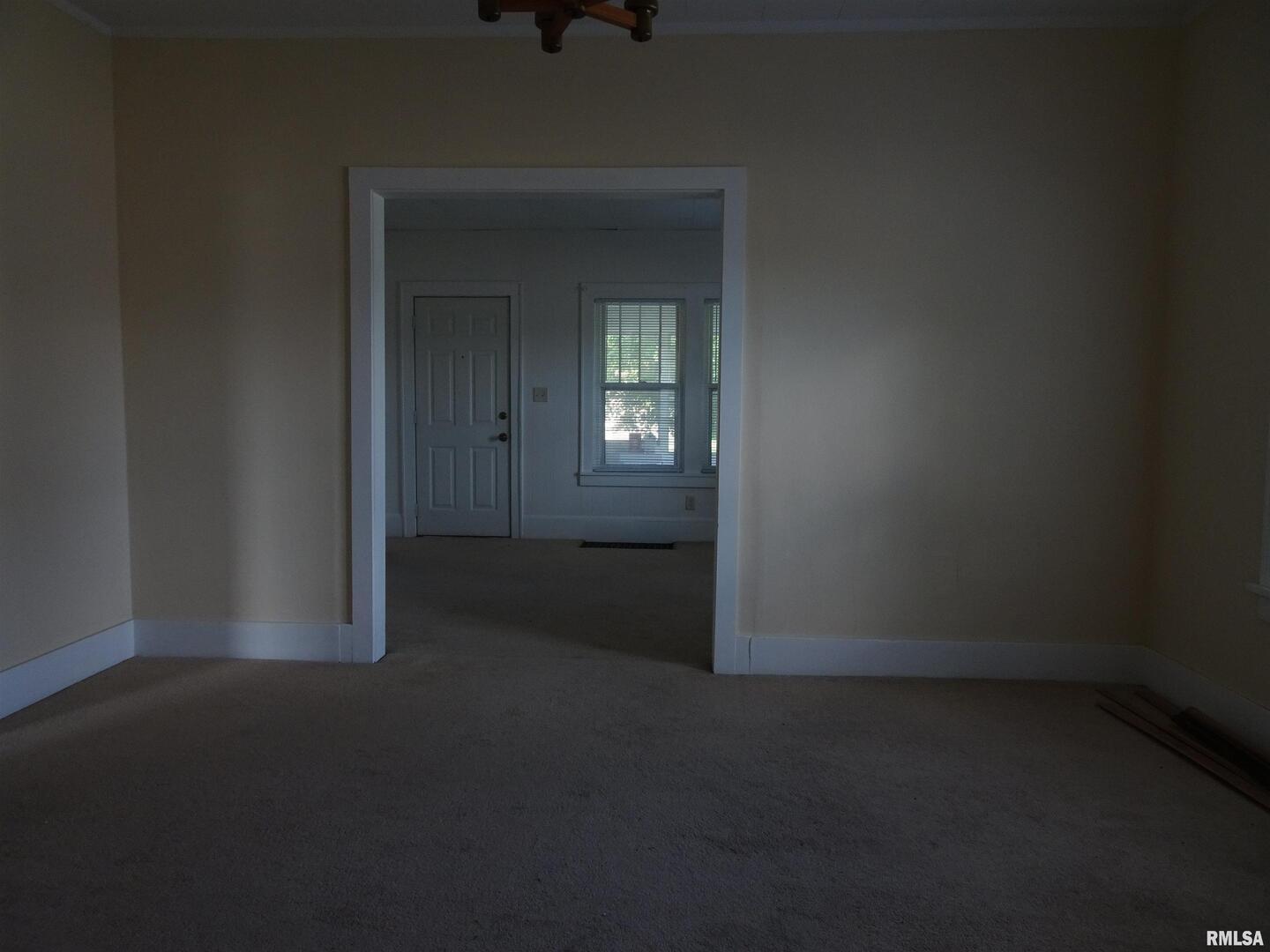 917 3rd Street Silvis, IL 61282 - Photo 5 of 22 a view of empty room with window