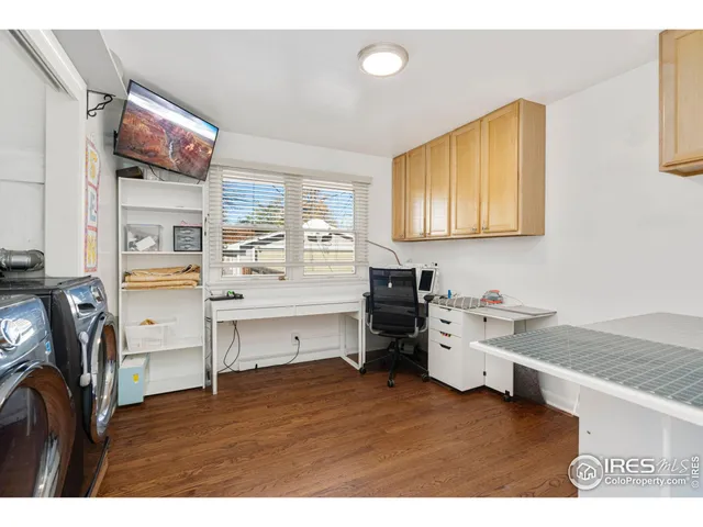 a kitchen with a stove a refrigerator and a sink