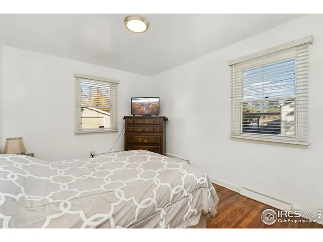 a bathroom with a tub a sink and a shower