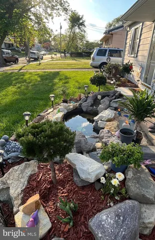 a view of a garden with lawn chairs