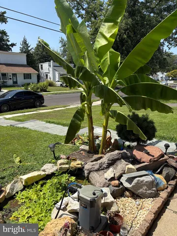 a view of yard with swimming pool and outdoor seating