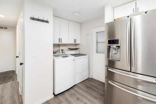 a kitchen with stainless steel appliances a refrigerator stove microwave and cabinets