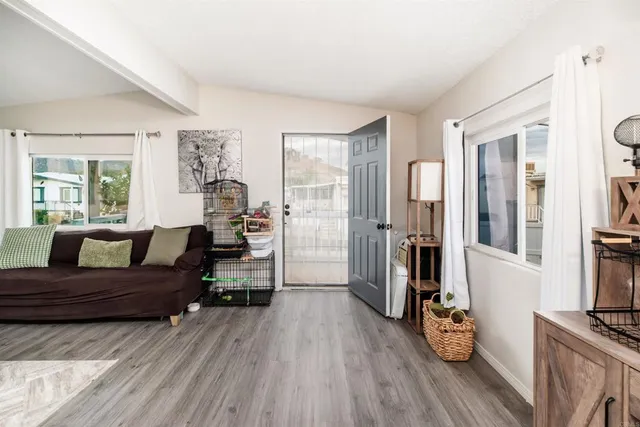 a living room with furniture and a large window