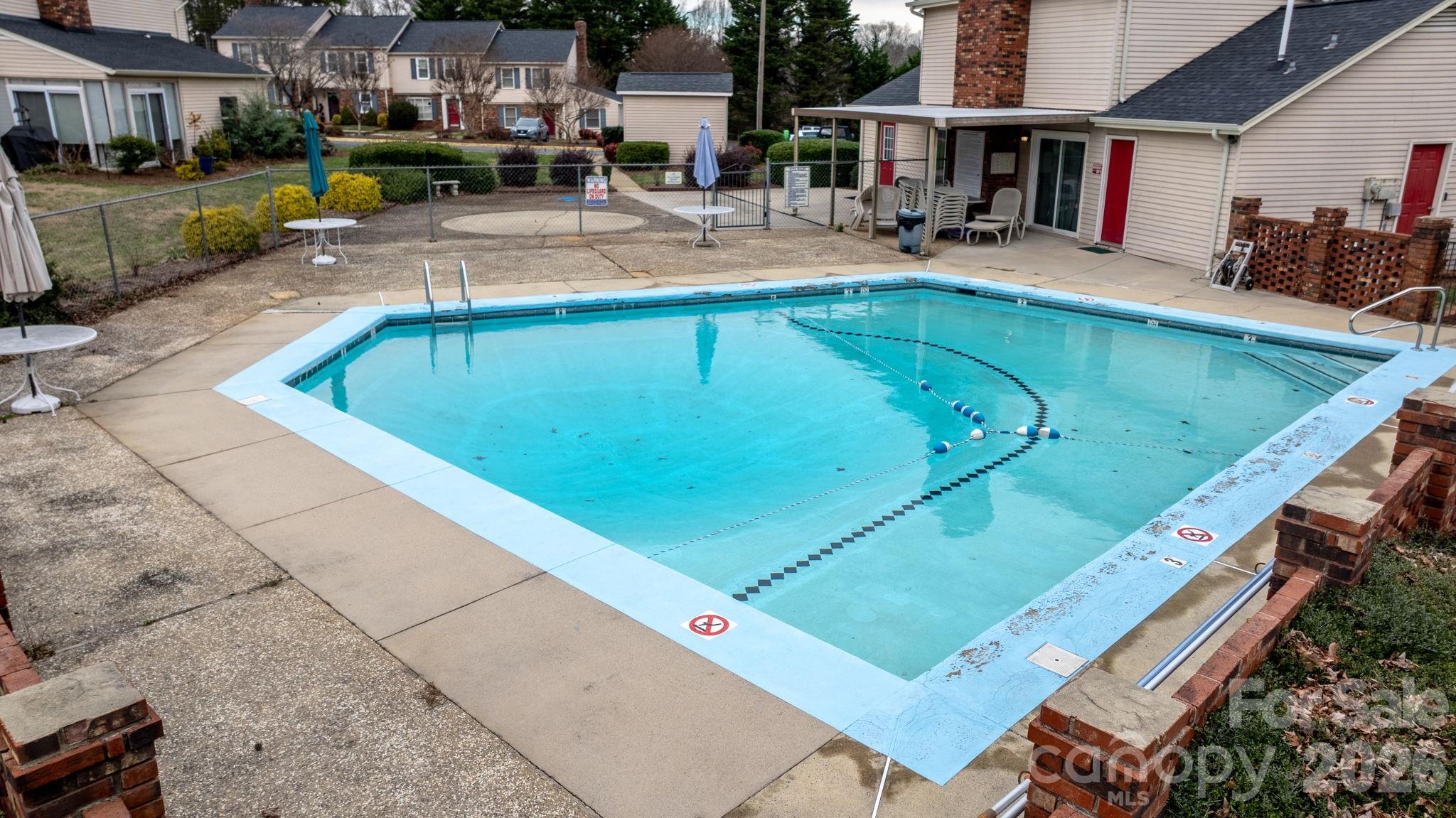 2705 North Center Street, Unit 60 Hickory, NC 28601 - Photo 26 of 27 a view of a swimming pool with a patio