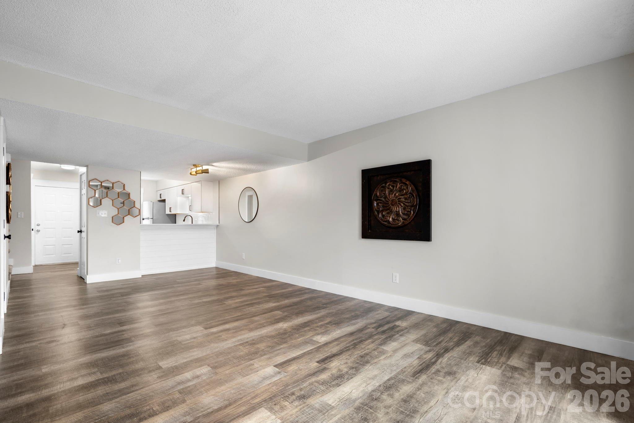 2705 North Center Street, Unit 60 Hickory, NC 28601 - Photo 6 of 27 a view of an empty room and wooden floor