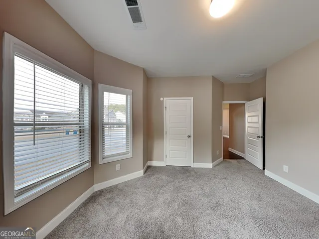 an empty room with windows