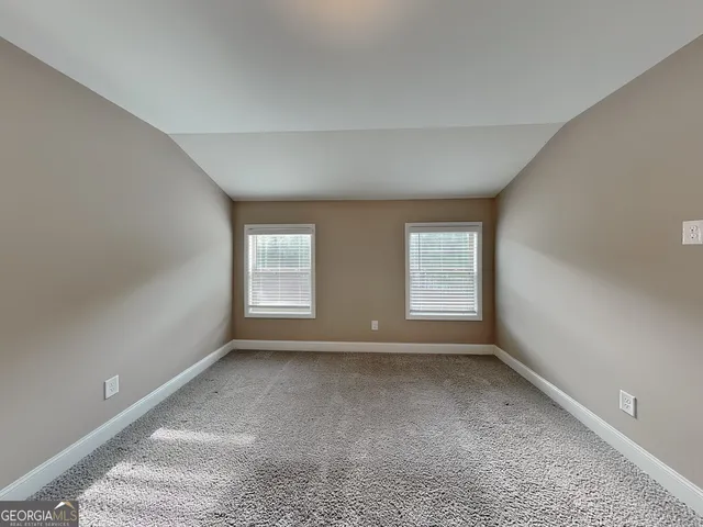 a view of room with window and a fireplace