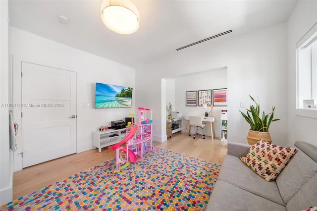 a room with furniture and a potted plant