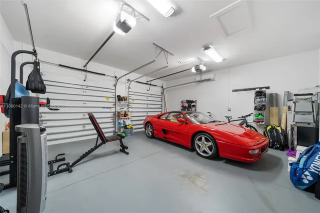 a view of a garage with cars