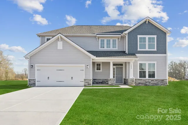 a view of an house with backyard porch and garden