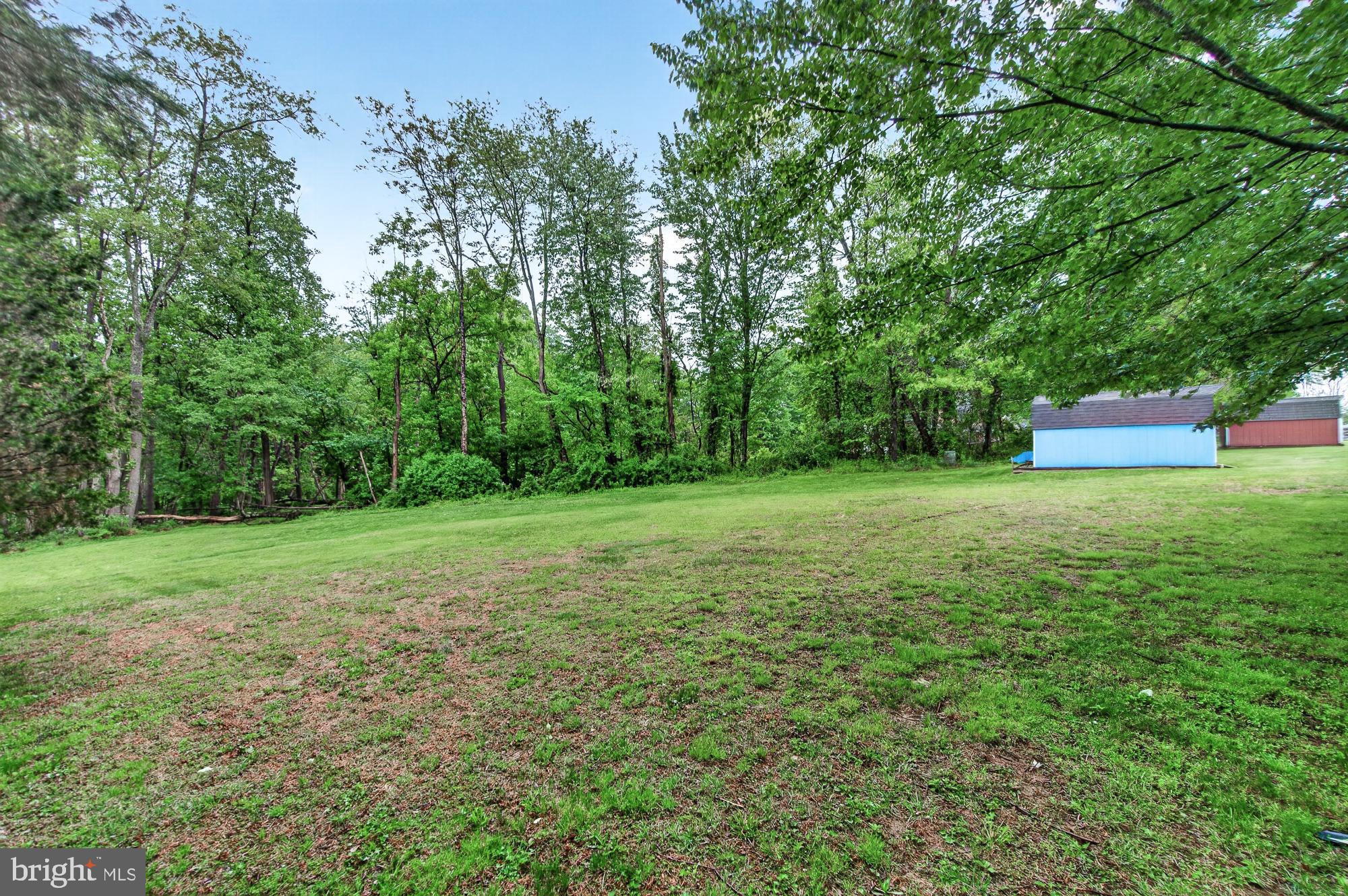 5601 Woodville Road Mount Airy, MD 21771 - Photo 53 of 54 a view of a garden with a house