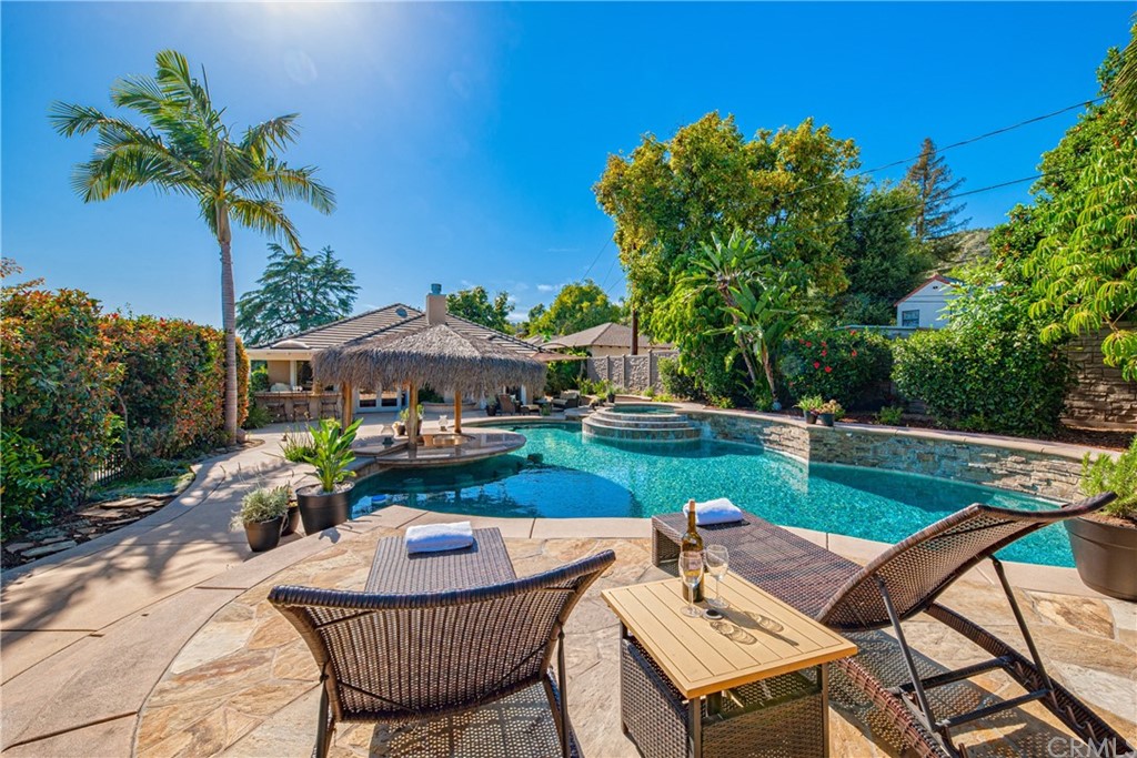 a view of an chairs and table in the patio