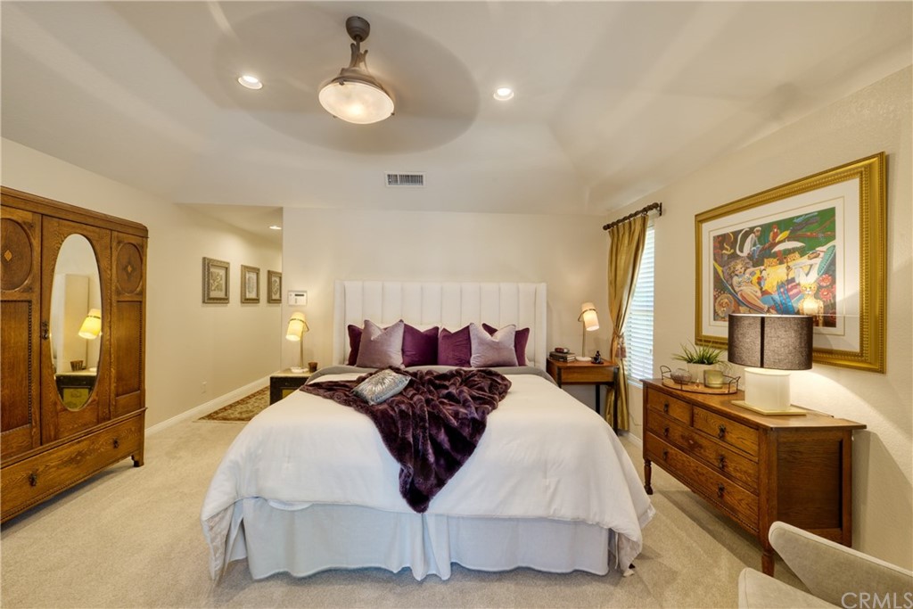 200 North Sunset Place Monrovia, CA 91016 - Photo 15 of 44 a spacious bedroom with a bed and glass windows