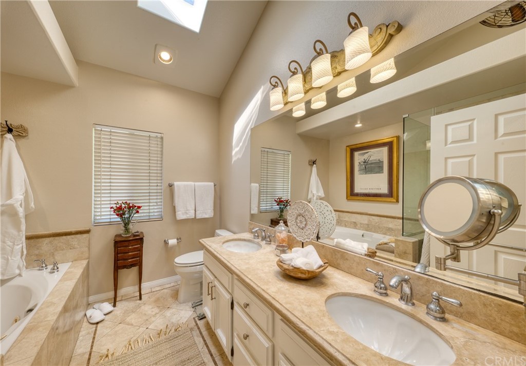 200 North Sunset Place Monrovia, CA 91016 - Photo 16 of 44 a bathroom with a granite countertop double vanity sink and a mirror