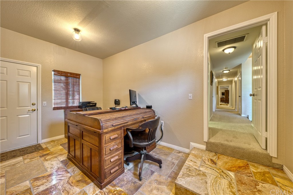 200 North Sunset Place Monrovia, CA 91016 - Photo 24 of 44 a room that has a bed and a table in it