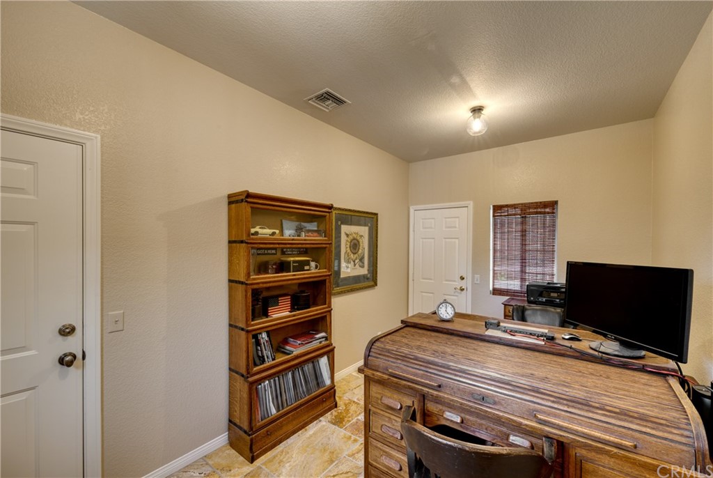 200 North Sunset Place Monrovia, CA 91016 - Photo 25 of 44 a bedroom with bed and a flat screen tv