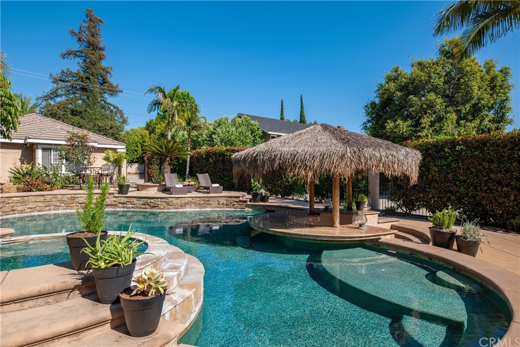 200 North Sunset Place Monrovia, CA 91016 - Photo 32 of 44 a view of a house with swimming pool and porch with furniture