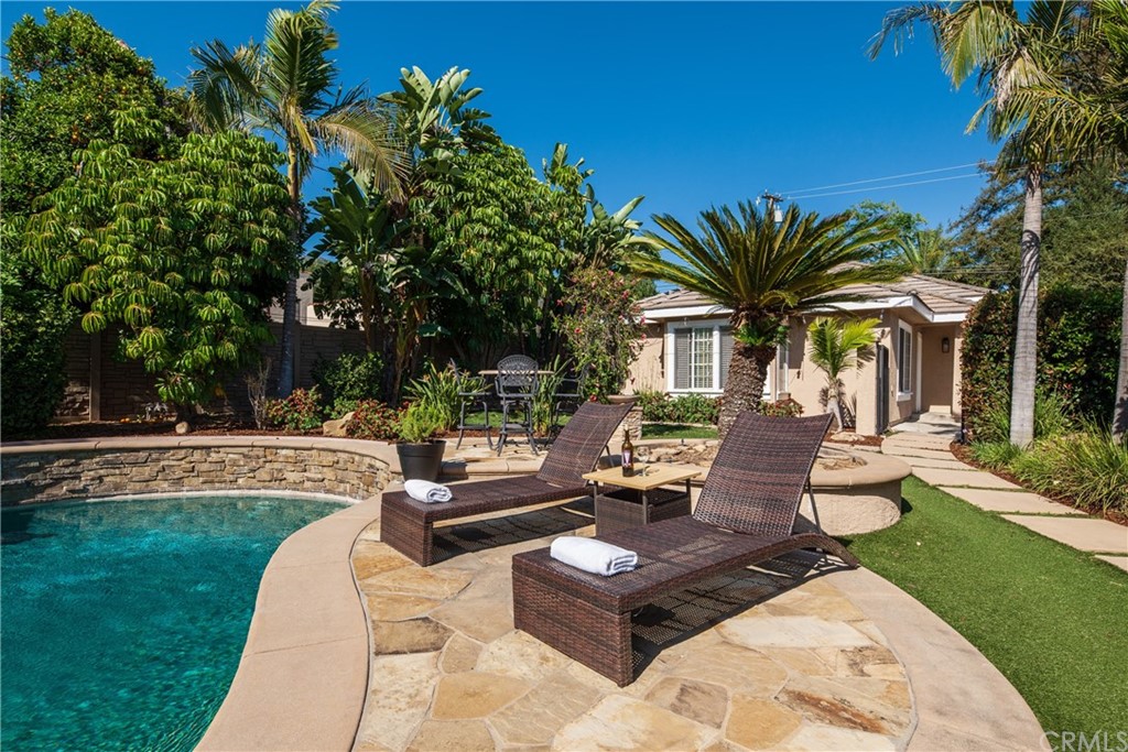 200 North Sunset Place Monrovia, CA 91016 - Photo 34 of 44 a view of a patio with couches and a table and chairs with garden