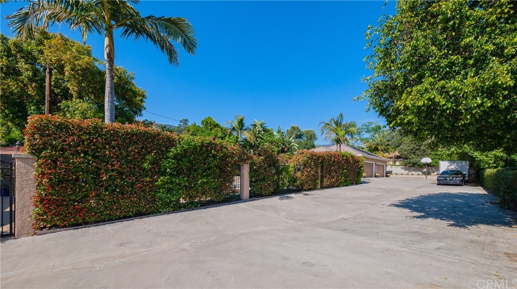 200 North Sunset Place Monrovia, CA 91016 - Photo 42 of 44 a view of a road with plants and palm trees