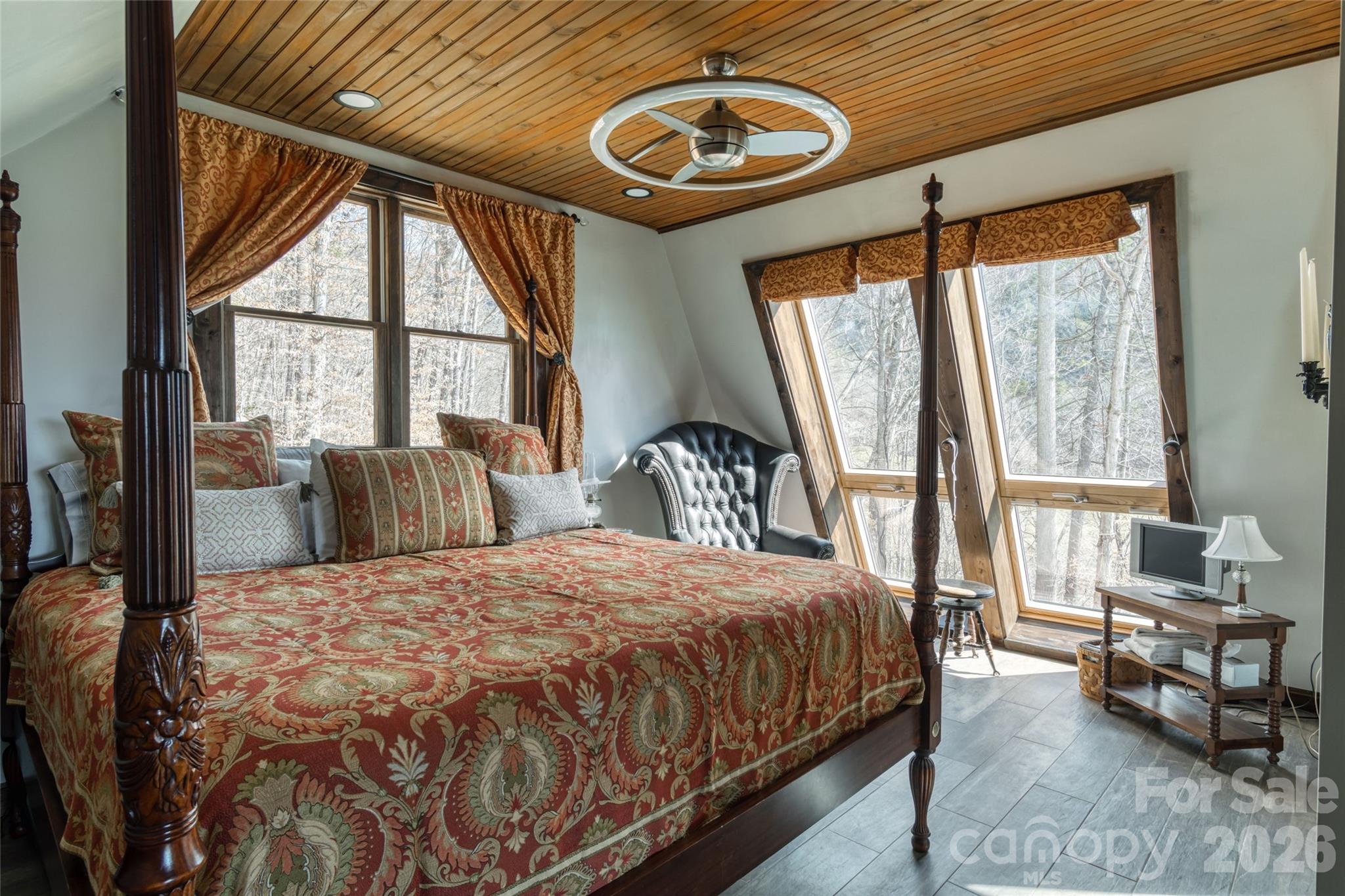 461 Ferguson Cove Loop Clyde, NC 28721 - Photo 43 of 46 a bedroom with a bed and a large window