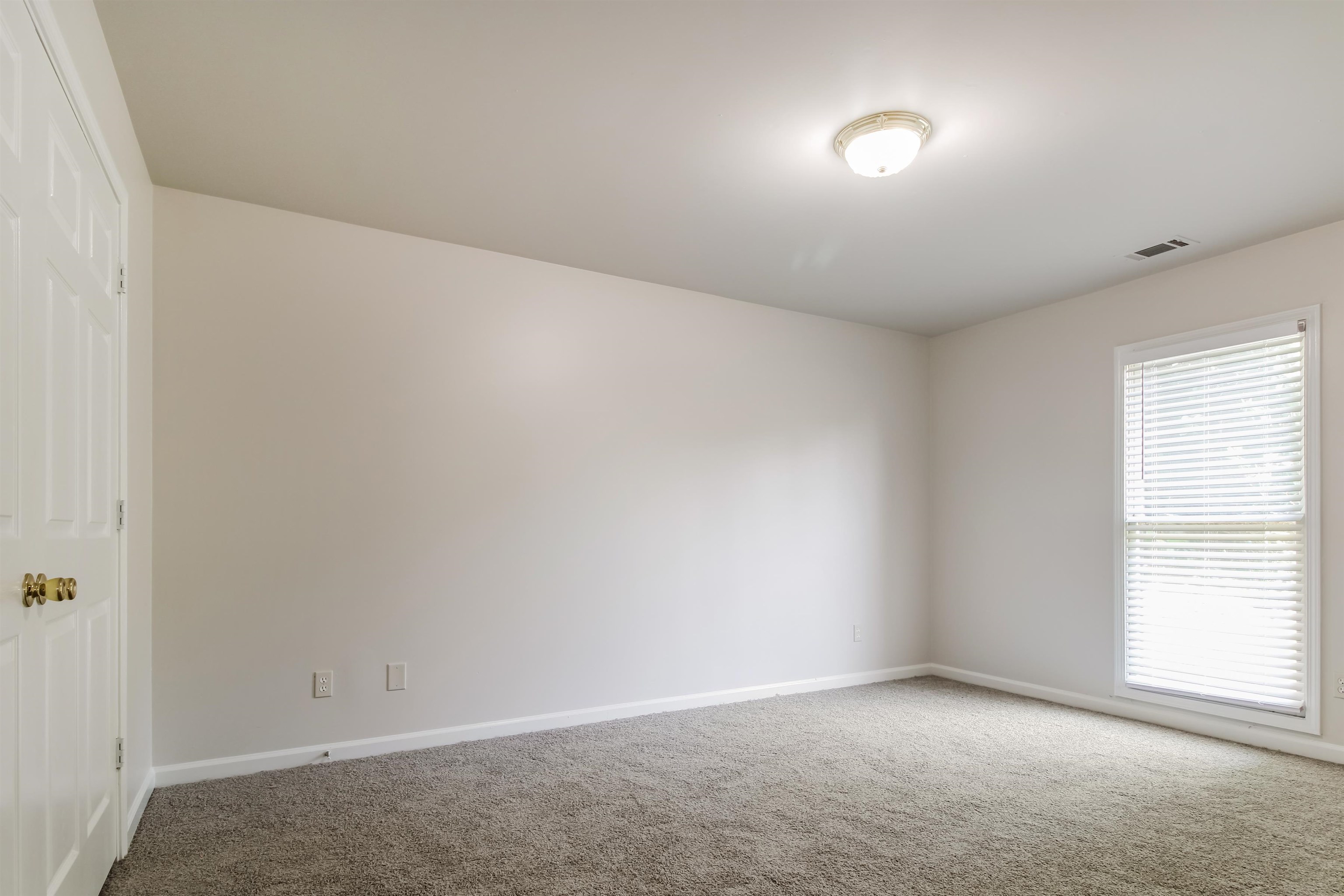 8859 Raspberry Lane Memphis, TN 38016 - Photo 12 of 16 View of carpeted empty room