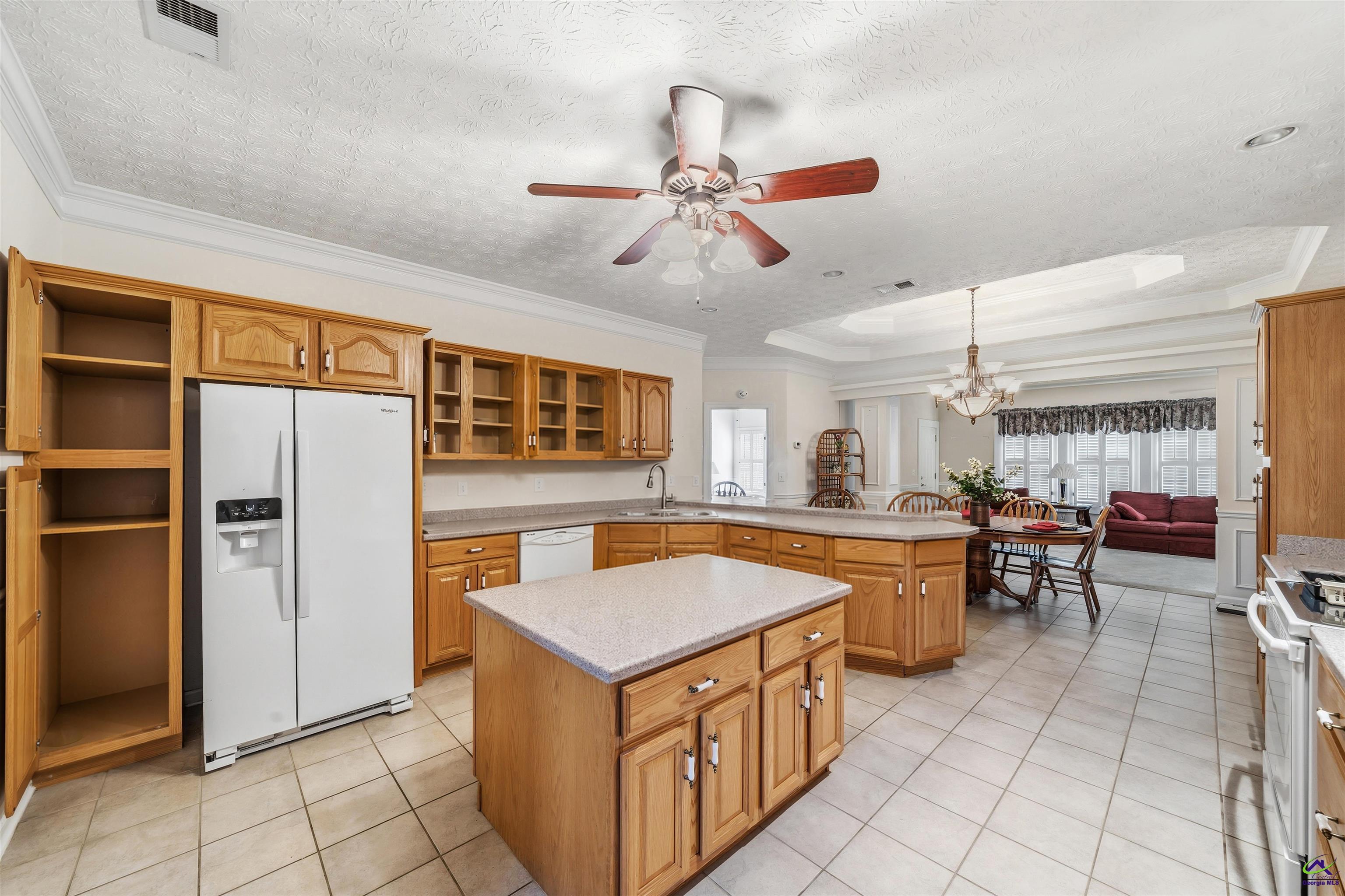206 North Hampton Place Perry, GA 31069 - Photo 11 of 20 a kitchen with stainless steel appliances granite countertop a sink and a refrigerator