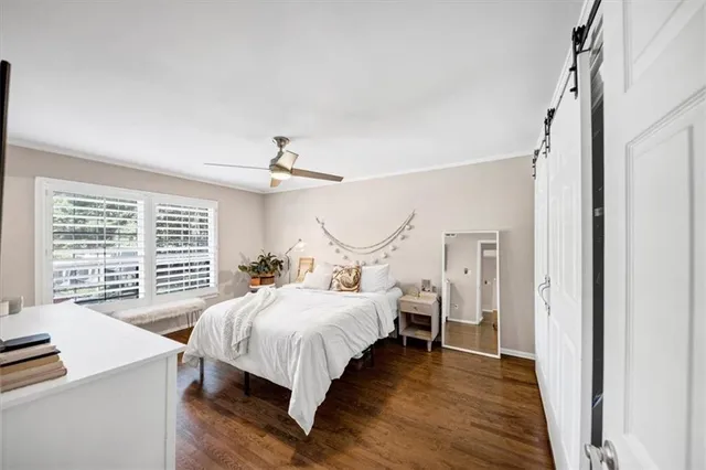 a bedroom with a bed and a table