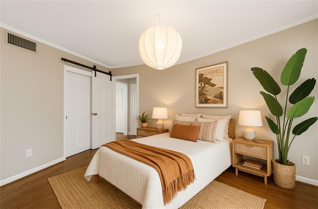 37 La Rue Place Northwest Atlanta, GA 30327 - Photo 18 of 43 a bedroom with bed and a potted plant