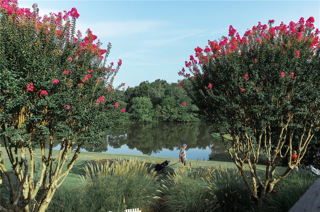 37 La Rue Place Northwest Atlanta, GA 30327 - Photo 29 of 43 a front view of a house with a yard and fountain
