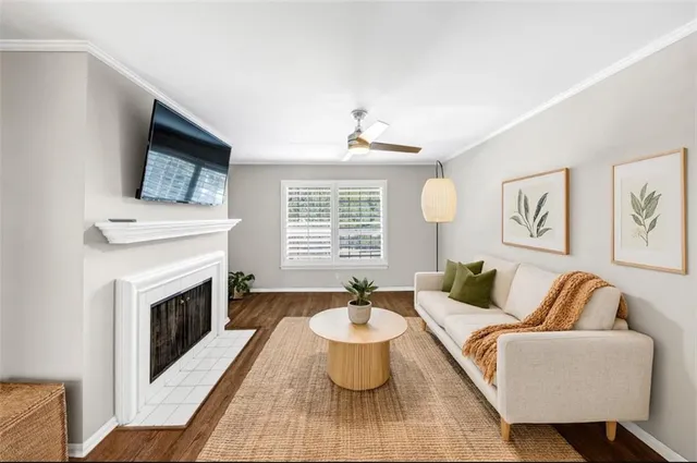 a living room with furniture and a fireplace