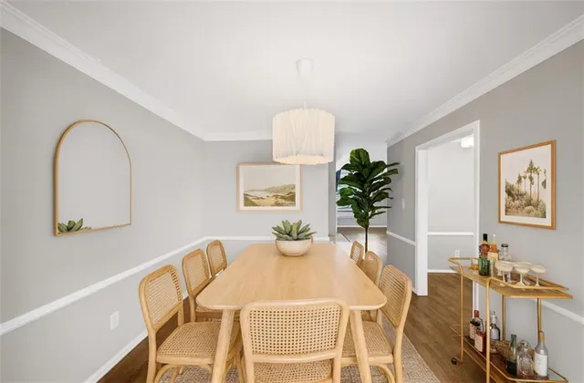 a view of a dining room with furniture and wooden floor
