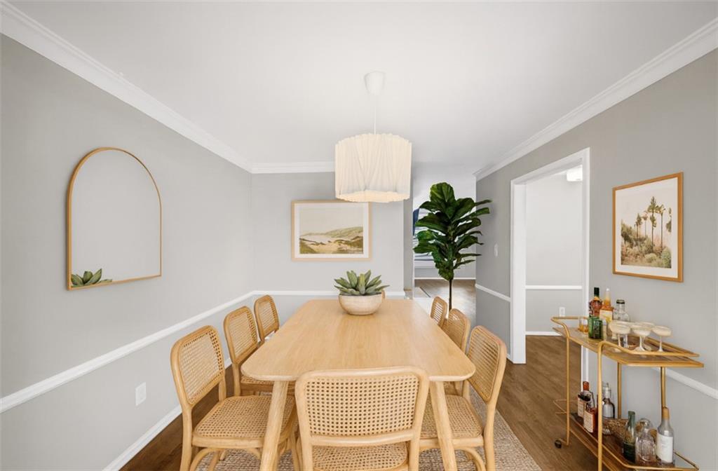37 La Rue Place Northwest Atlanta, GA 30327 - Photo 7 of 43 a view of a dining room with furniture and wooden floor