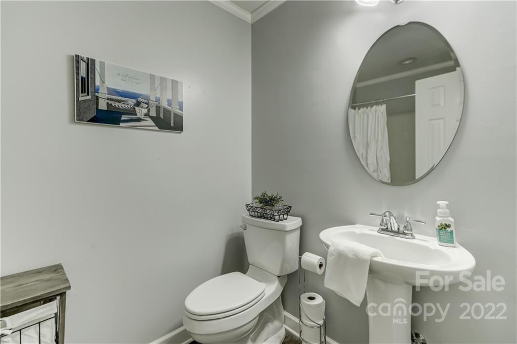339 East Rebound Road Lancaster, SC 29720 - Photo 28 of 40 a bathroom with a toilet a sink and mirror