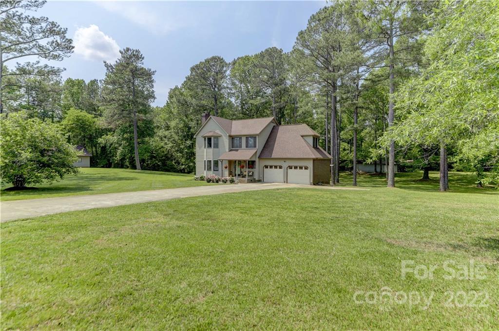 339 East Rebound Road Lancaster, SC 29720 - Photo 3 of 40 a house with green field in front of it