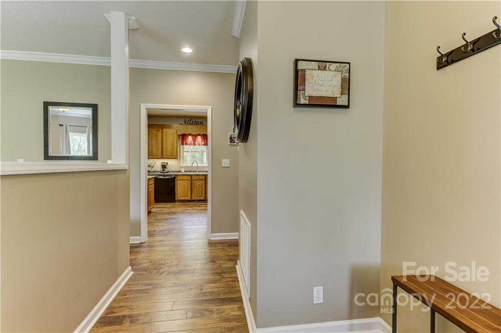 339 East Rebound Road Lancaster, SC 29720 - Photo 9 of 40 a view of a hallway with wooden floor and a cabinet