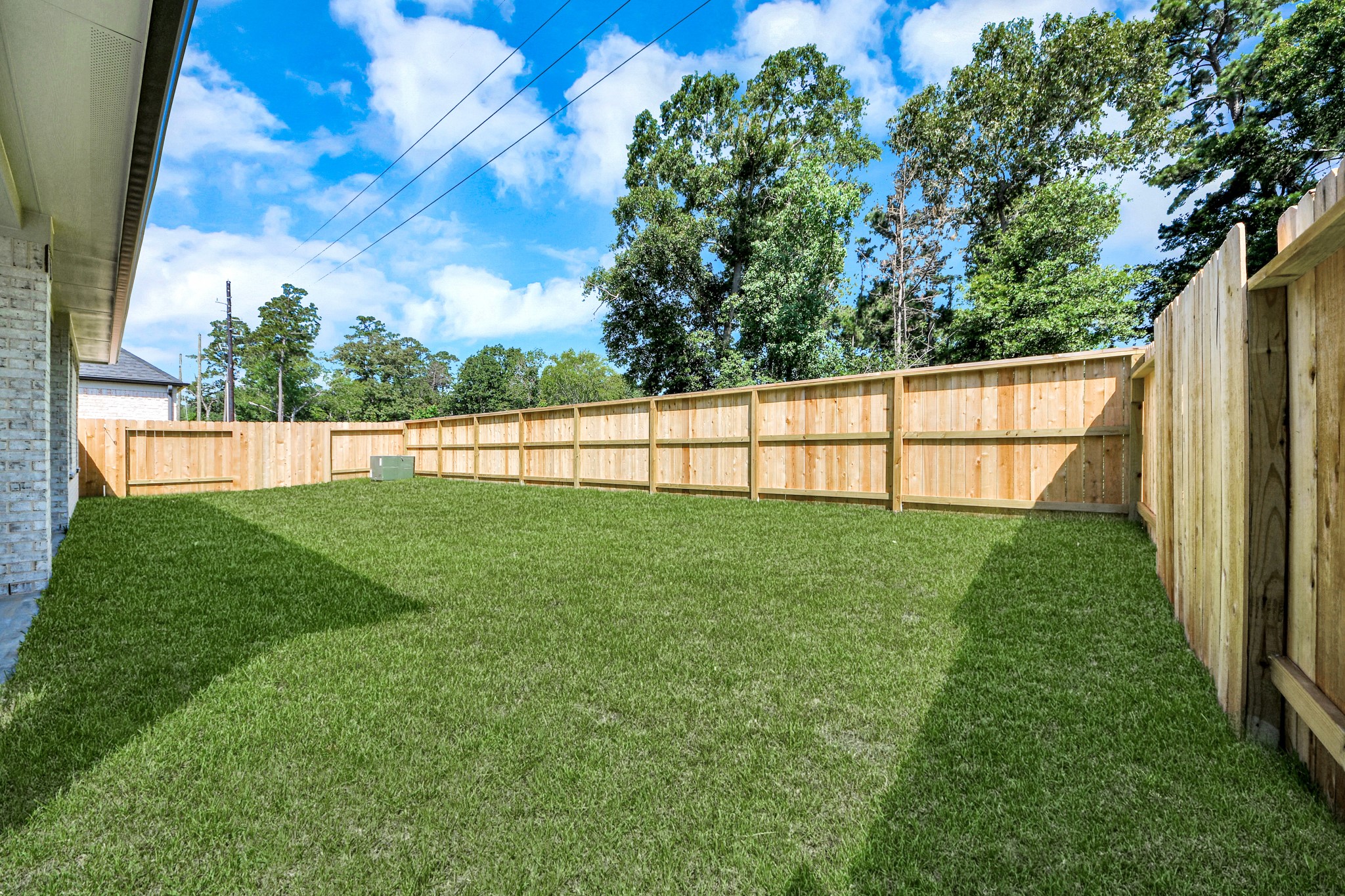 3035 Native Spg Drive Spring, TX 77373 - Photo 7 of 43 Backyard retreat, offering an abundance of space for kids to play and explore. The possibilities are endless in this outdoor haven, where the joy of open-air activities and family gatherings awaits.