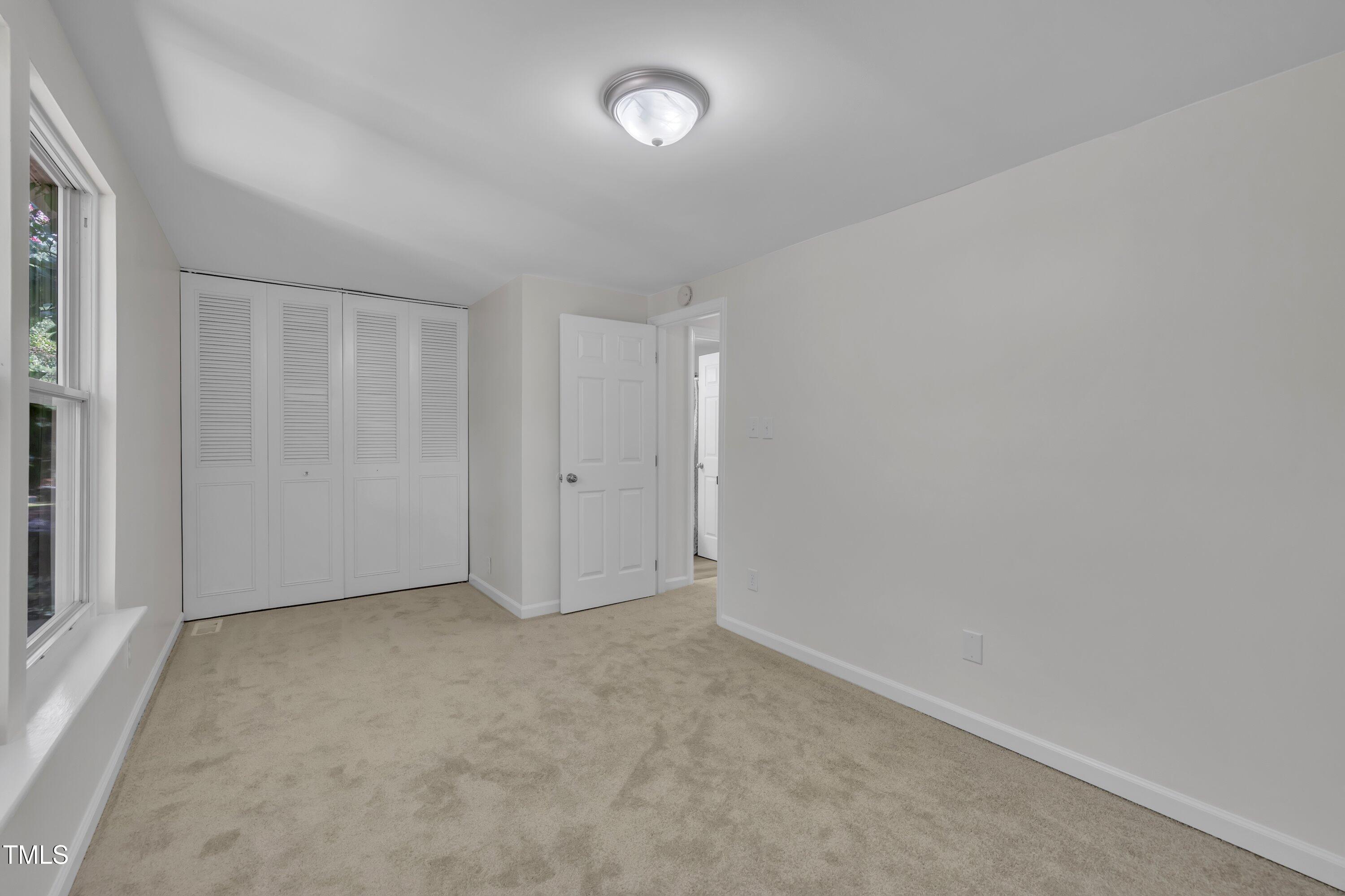 632 Middleton Avenue Cary, NC 27513 - Photo 28 of 34 a view of an empty room and a window