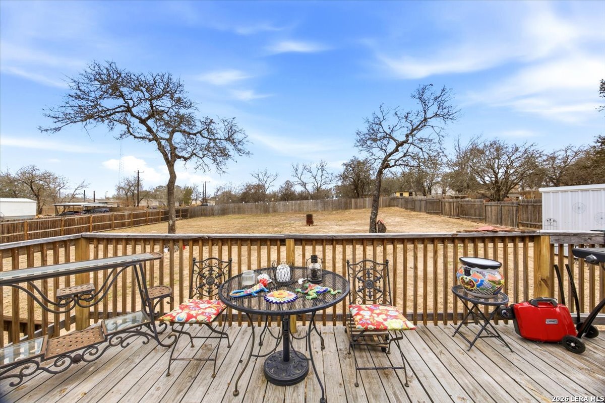 101 Rocky Ridge Drive Poteet, TX 78065 - Photo 28 of 36 a view of a balcony with wooden floor and seating space