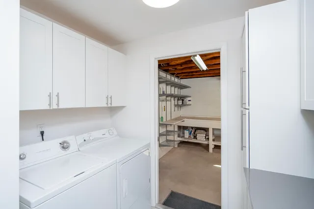 a view of kitchen and utility room with closet dryer