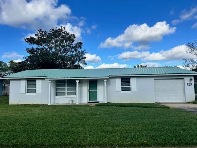 a house view with a garden space