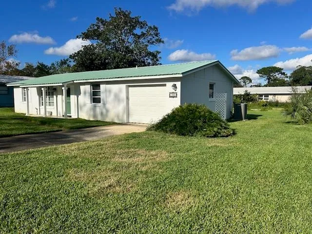 a house view with a garden space