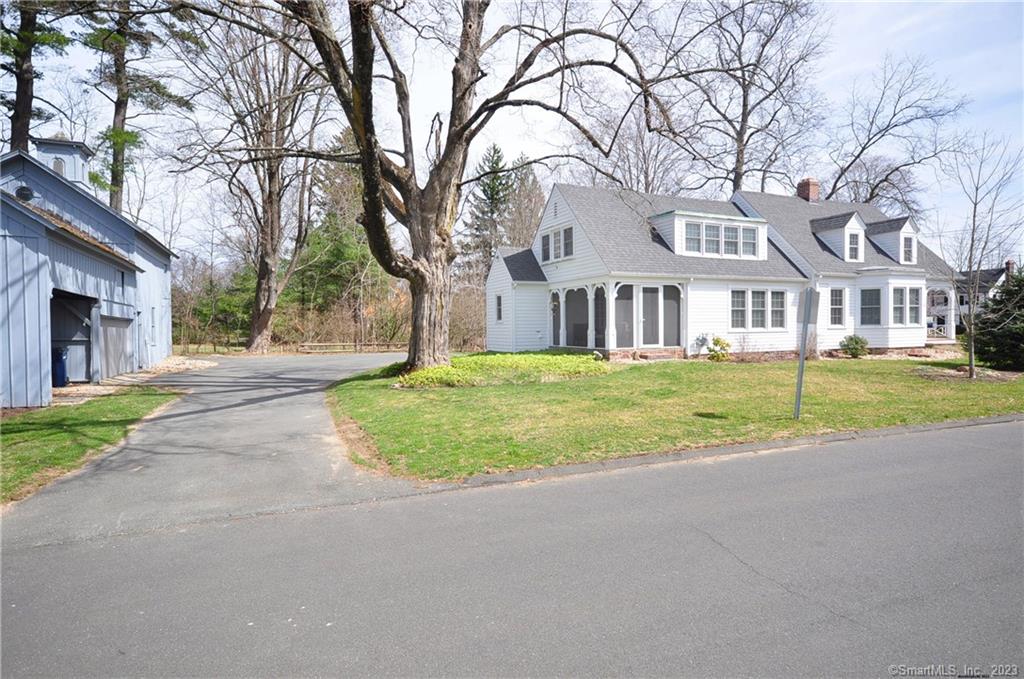 1 Copper Brook Circle, Unit 1 Granby, CT 06035 - Photo 1 of 1 a house with palm trees in front of it