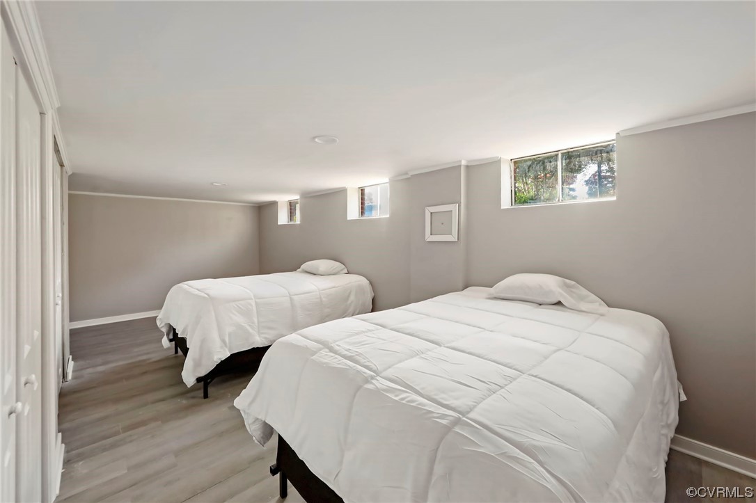 3248 West Hundred Road Chester, VA 23831 - Photo 15 of 27 a bedroom with two beds and wooden floor