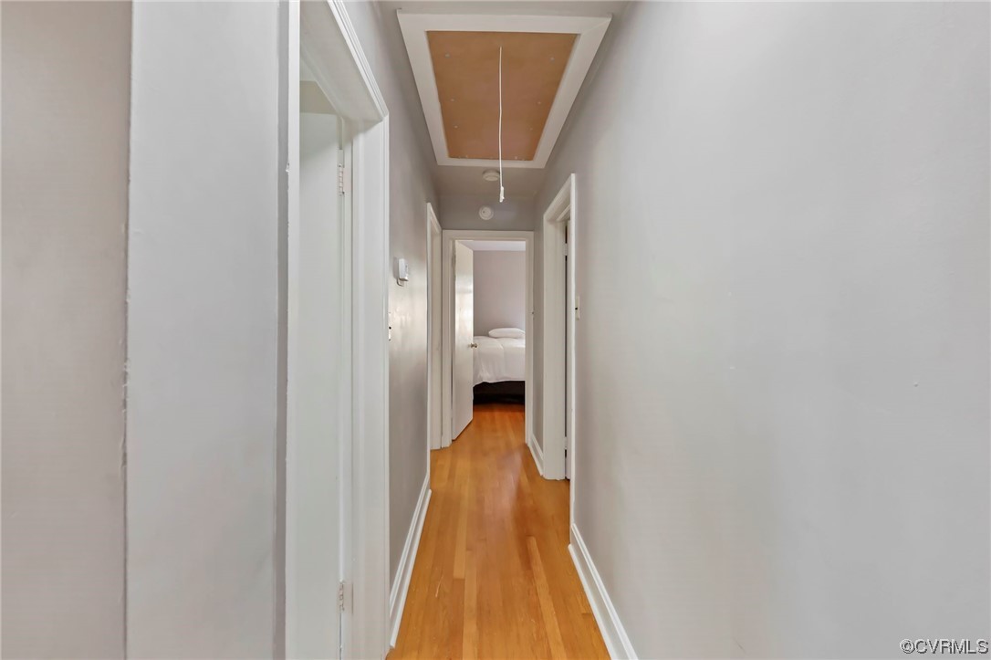 3248 West Hundred Road Chester, VA 23831 - Photo 17 of 27 a view of a hallway with wooden floor and a white cabinet